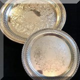 S31. Set of 2 round silverplate trays with pierced edges. 15”w and 10”w - $28 
